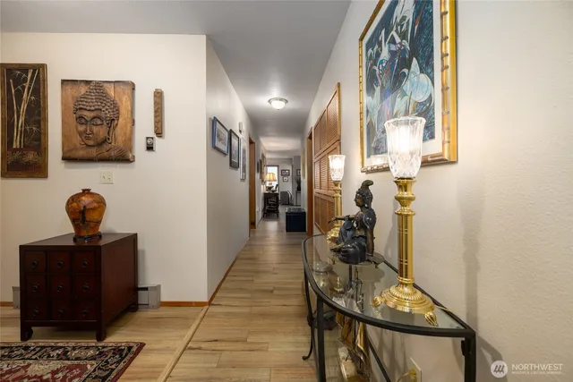 a view of a hallway with seating area