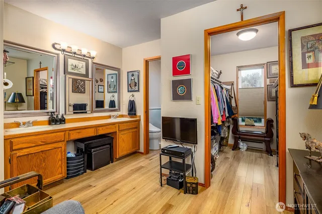 a view of a livingroom with furniture hardwood floor and a view of living room