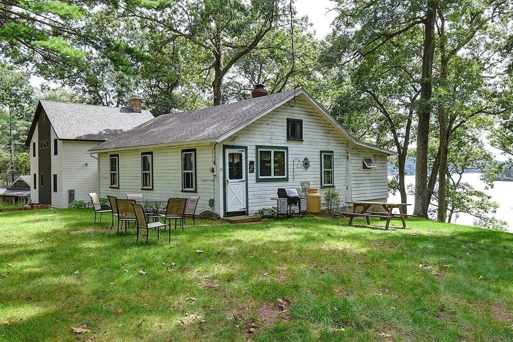 20 Old Acres Road Holland, MA 01521 - Photo 1 of 36 a view of a house with a yard and sitting area