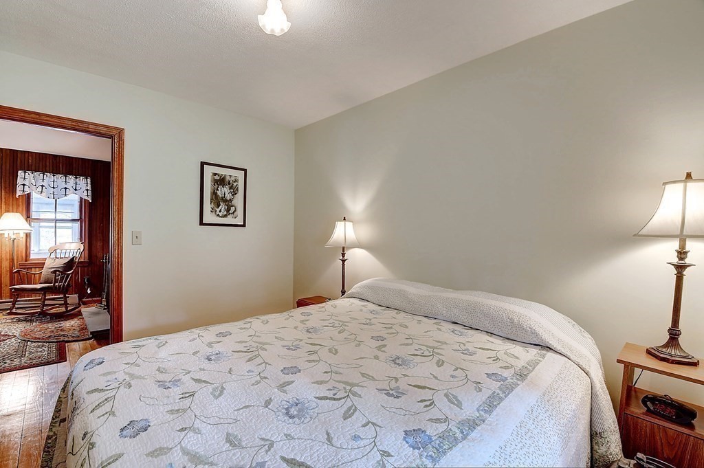 20 Old Acres Road Holland, MA 01521 - Photo 17 of 36 a bedroom with a bed and a lamp