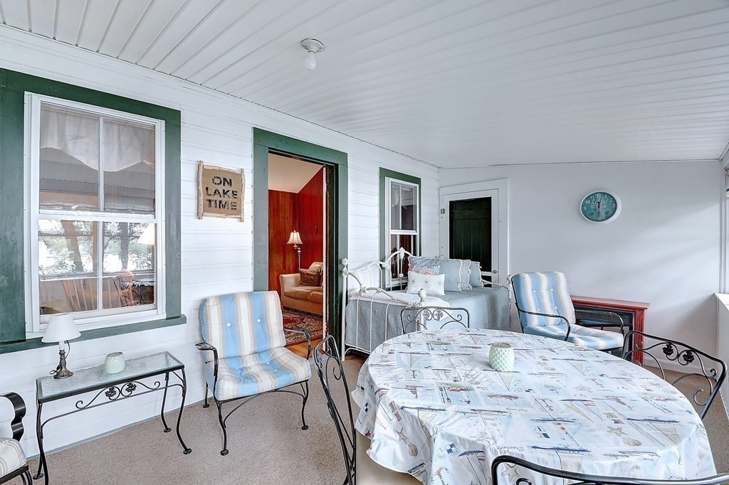 20 Old Acres Road Holland, MA 01521 - Photo 23 of 36 a living room with furniture a flat screen tv and a large window