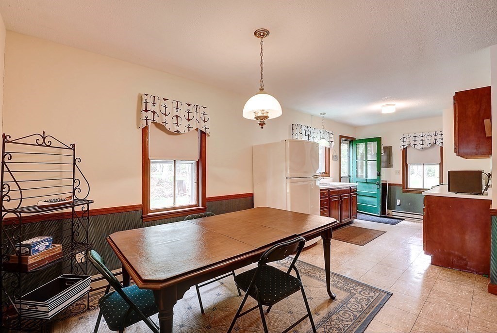 20 Old Acres Road Holland, MA 01521 - Photo 8 of 36 a view of a dining room with furniture and window