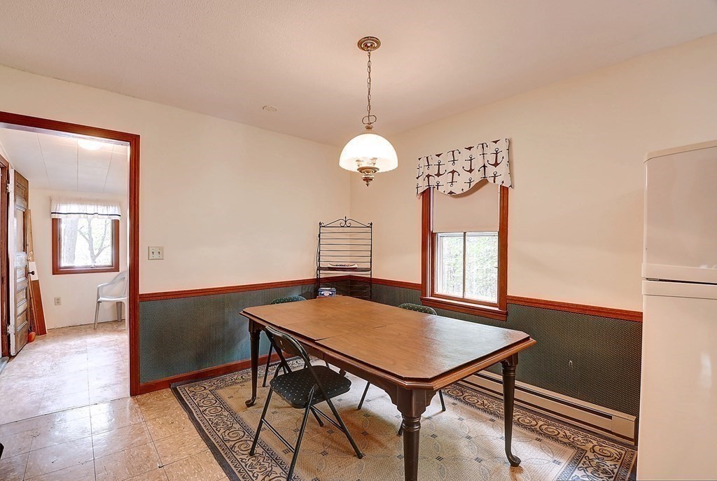 20 Old Acres Road Holland, MA 01521 - Photo 9 of 36 a view of a dining room with furniture window and wooden floor