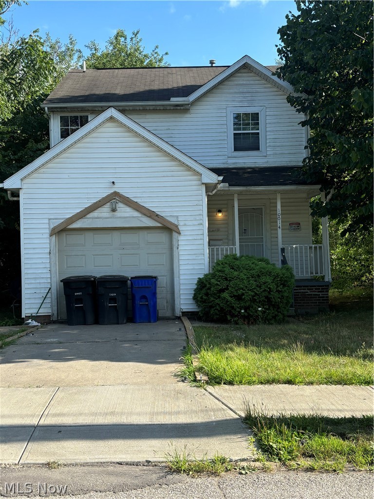 10014 Reno Avenue Cleveland, OH 44105 - Photo 1 of 11 View of front of house featuring a garage and covered porch