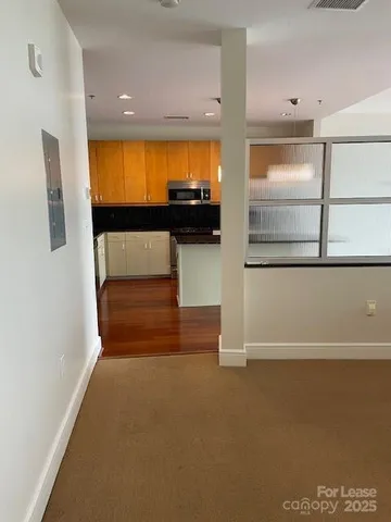 a view of entryway with wooden floor