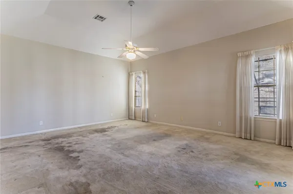 an empty room with a view of a bathroom