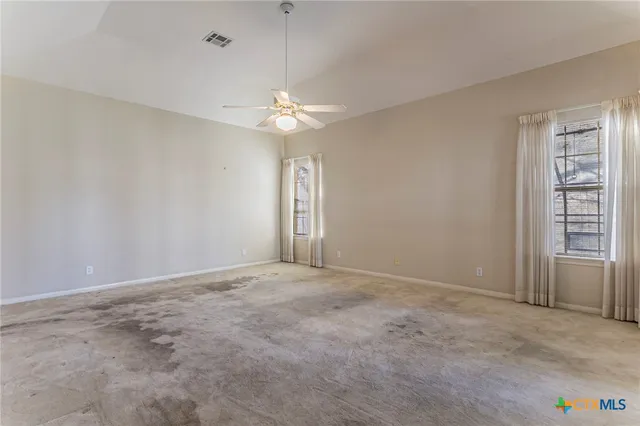 an empty room with a view of a bathroom