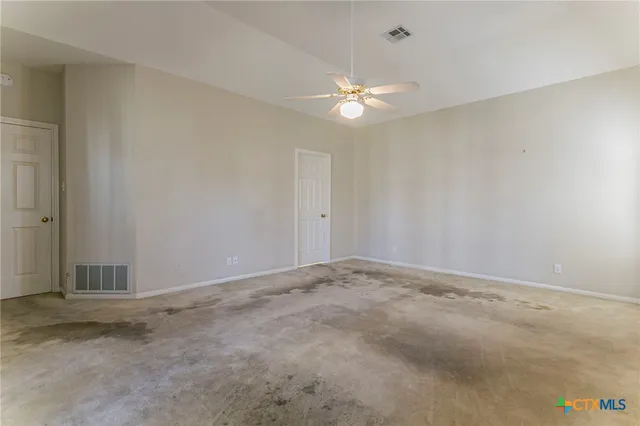 a bathroom with a bathtub a double vanity sink and mirror