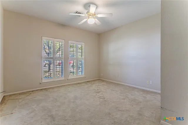 a bathroom with a granite countertop sink mirror and a bathtub