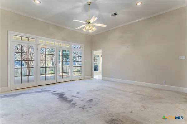 a kitchen with stainless steel appliances a refrigerator and cabinets