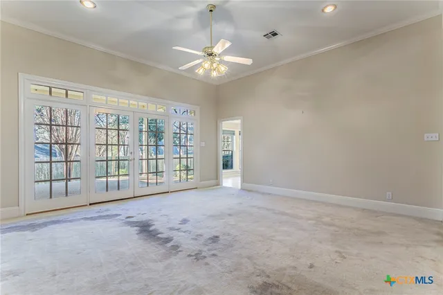 a kitchen with stainless steel appliances a refrigerator and cabinets