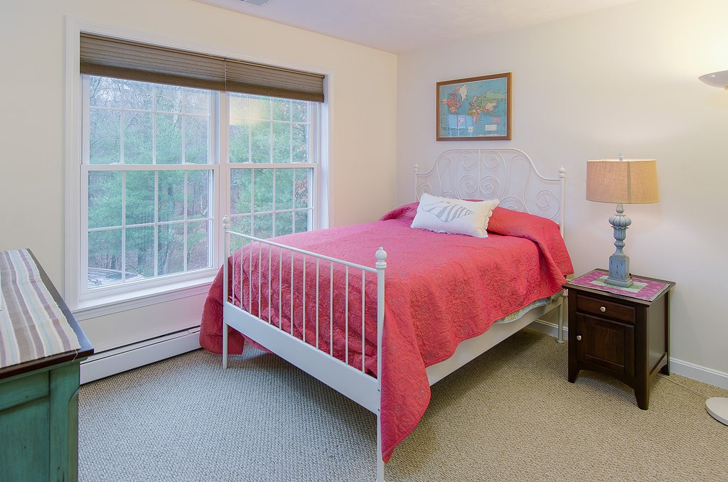 2 Sterling Lane, Unit 2 Walpole, MA 02081 - Photo 12 of 27 a bedroom with a bed and a window