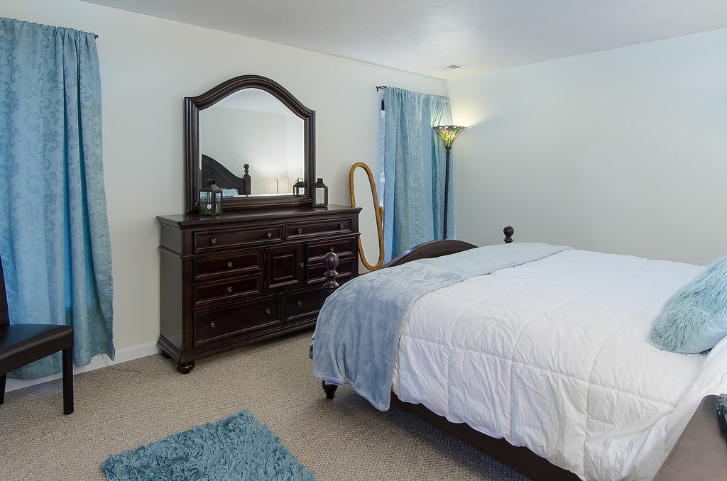 2 Sterling Lane, Unit 2 Walpole, MA 02081 - Photo 16 of 27 a bedroom with a bed and a dresser