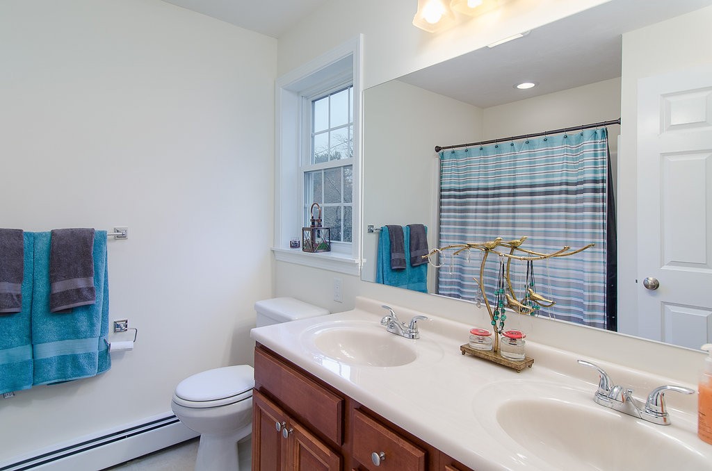 2 Sterling Lane, Unit 2 Walpole, MA 02081 - Photo 18 of 27 a bathroom with a sink toilet and shower