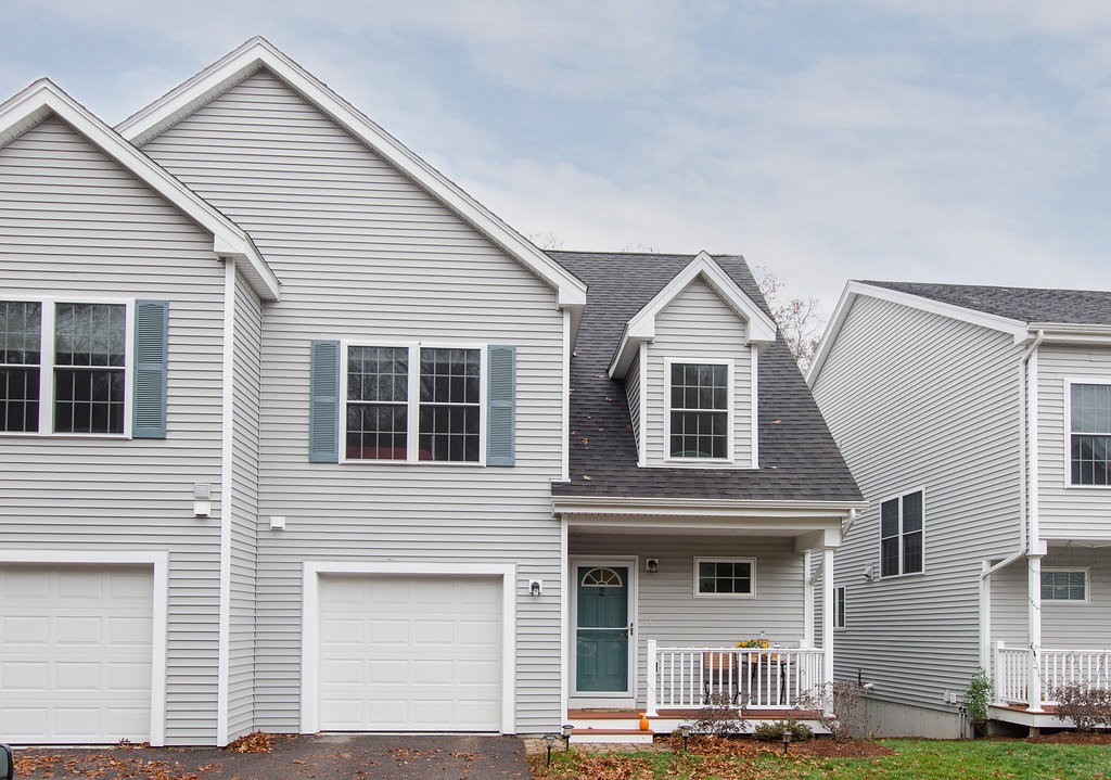 2 Sterling Lane, Unit 2 Walpole, MA 02081 - Photo 26 of 27 a front view of a house with garage