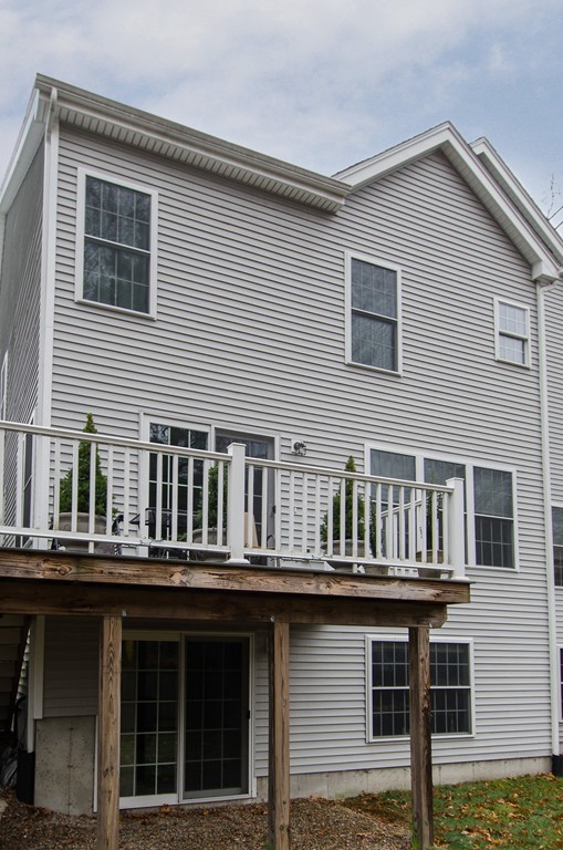 2 Sterling Lane, Unit 2 Walpole, MA 02081 - Photo 27 of 27 a front view of a house with balcony