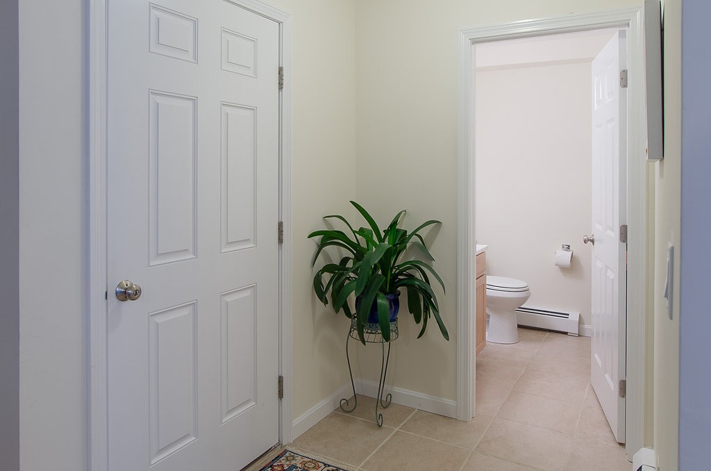 2 Sterling Lane, Unit 2 Walpole, MA 02081 - Photo 8 of 27 a view of entryway with wooden floor