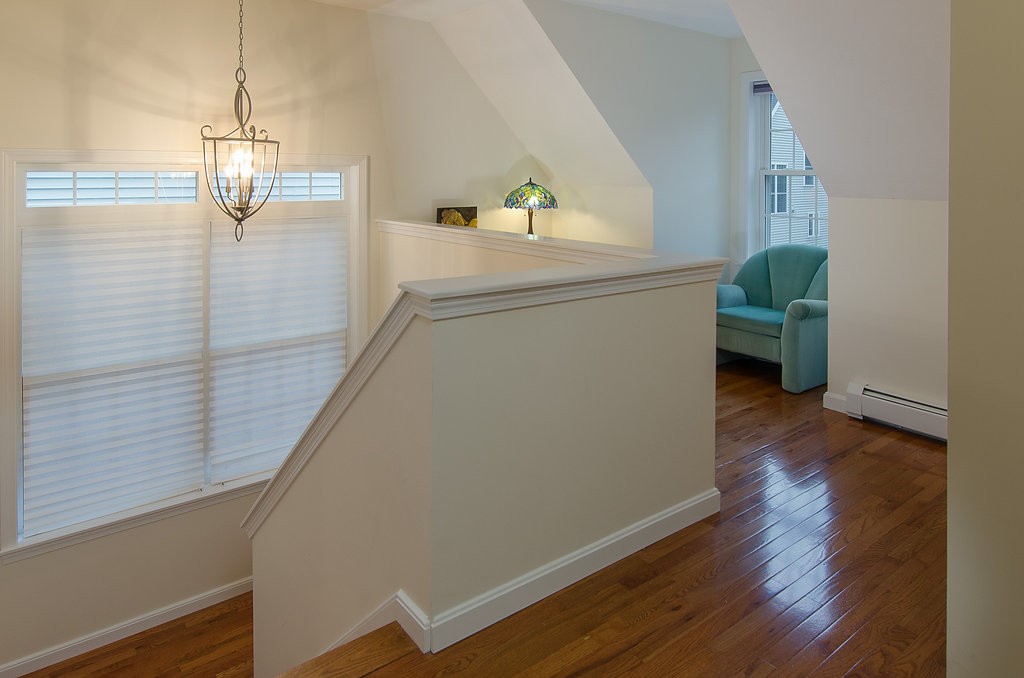 2 Sterling Lane, Unit 2 Walpole, MA 02081 - Photo 10 of 27 a view of a hallway view with wooden floor