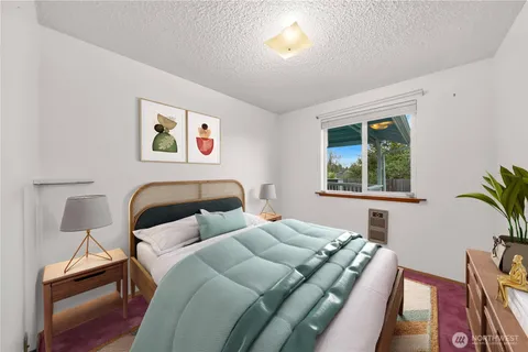 a bedroom with bed and a window