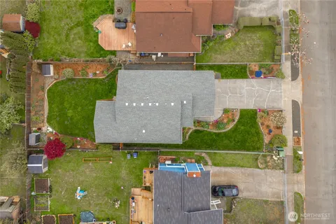 an aerial view of a house with a yard