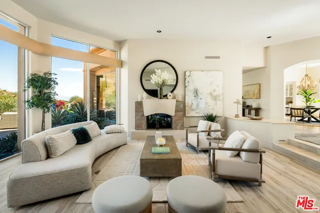 a living room with fireplace furniture and a flat screen tv