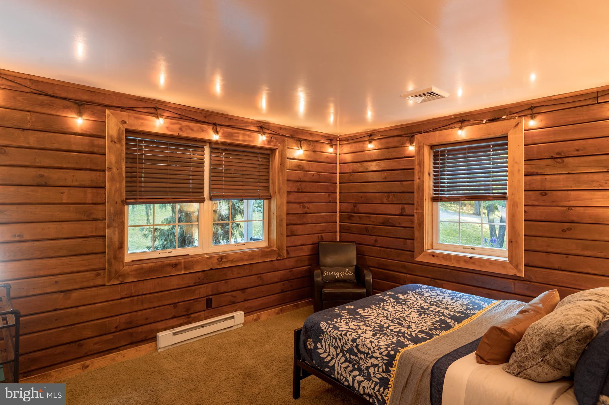 227 Reifsnyder Road Lititz, PA 17543 - Photo 14 of 21 Bedroom with exposed log walls