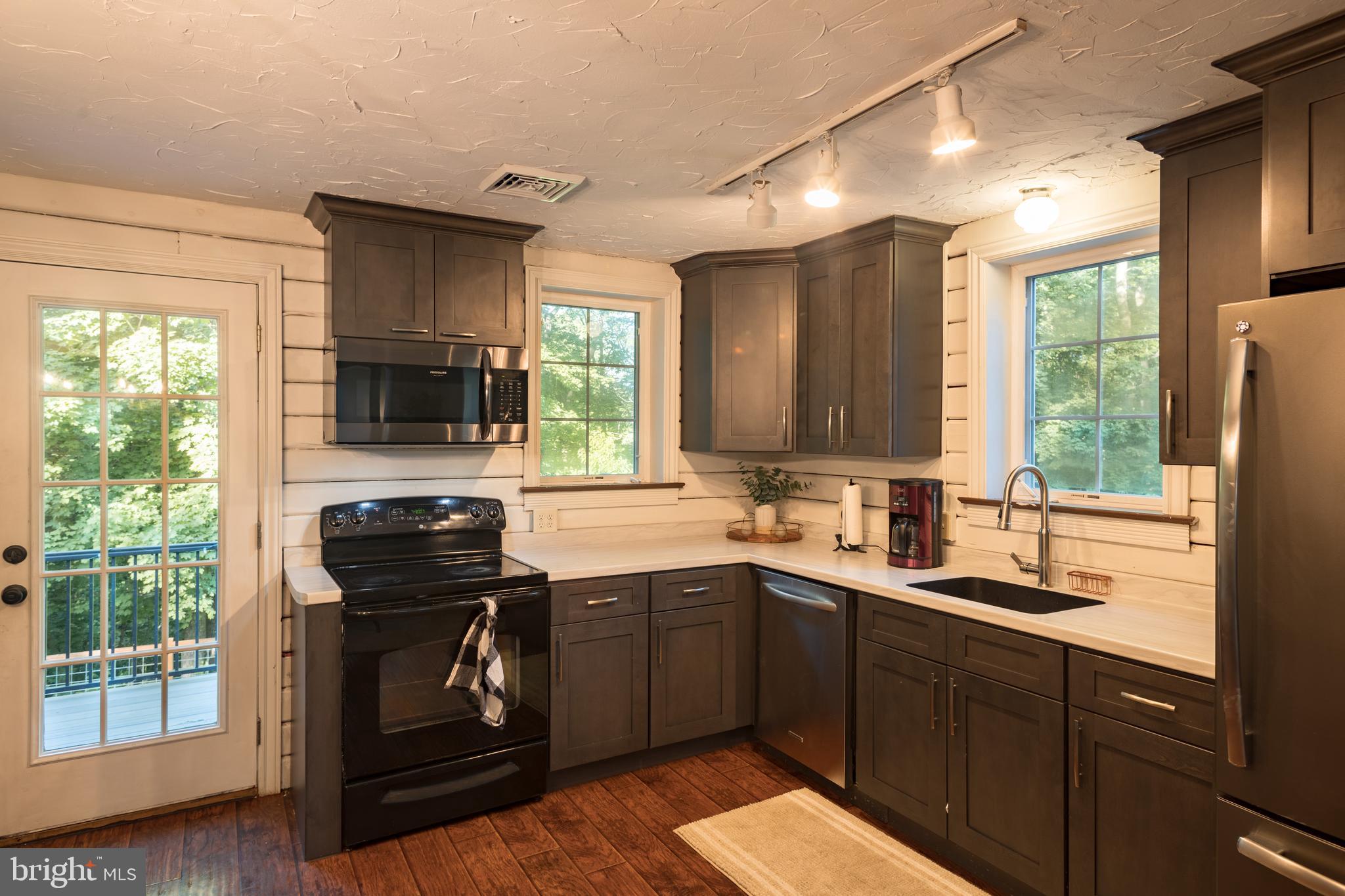 227 Reifsnyder Road Lititz, PA 17543 - Photo 8 of 21 Kitchen with door to deck