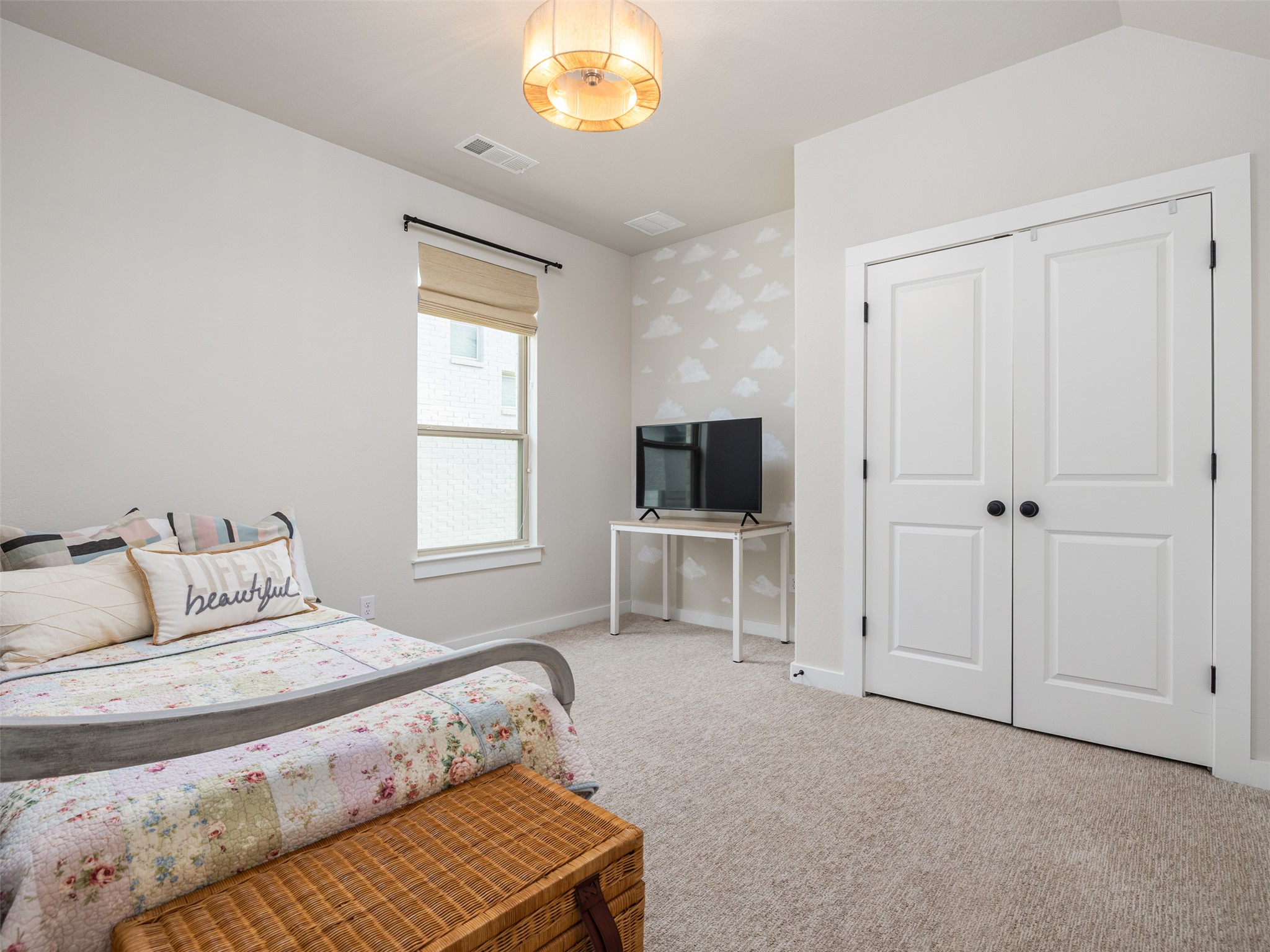 233 Arrowhead Mound Road Georgetown, TX 78628 - Photo 14 of 40 Bedroom featuring light carpet and a closet