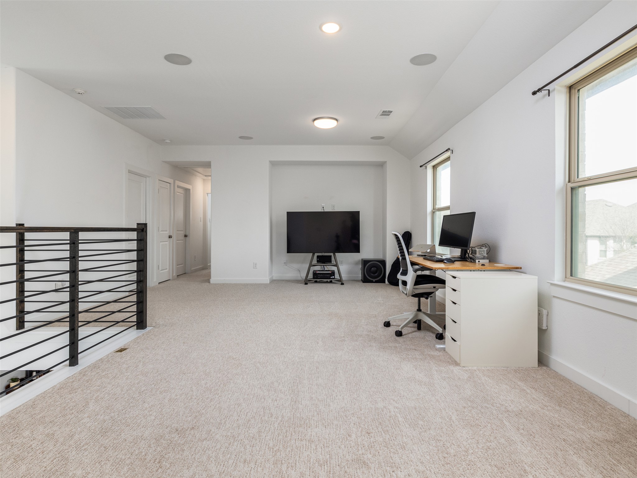 233 Arrowhead Mound Road Georgetown, TX 78628 - Photo 18 of 40 Office space with light colored carpet, lofted ceiling, and recessed lighting