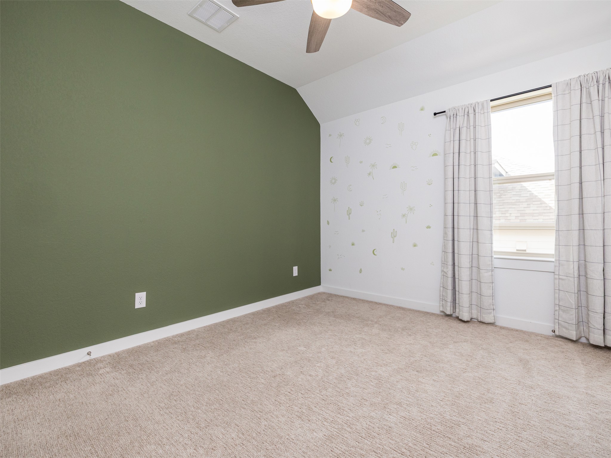 233 Arrowhead Mound Road Georgetown, TX 78628 - Photo 21 of 40 Carpeted spare room featuring ceiling fan and lofted ceiling