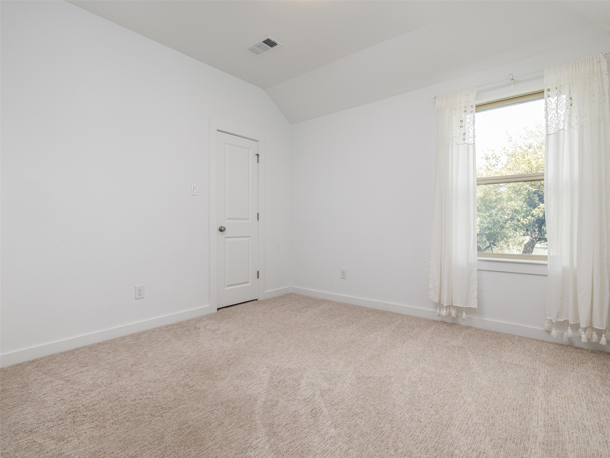 233 Arrowhead Mound Road Georgetown, TX 78628 - Photo 23 of 40 Unfurnished room featuring lofted ceiling and light carpet