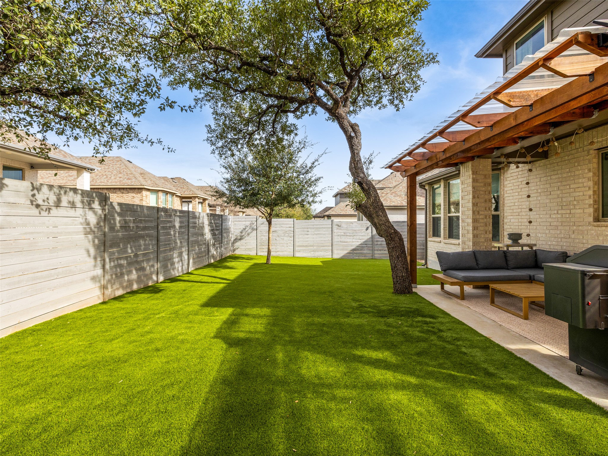 233 Arrowhead Mound Road Georgetown, TX 78628 - Photo 24 of 40 Fenced backyard featuring outdoor furniture and a patio