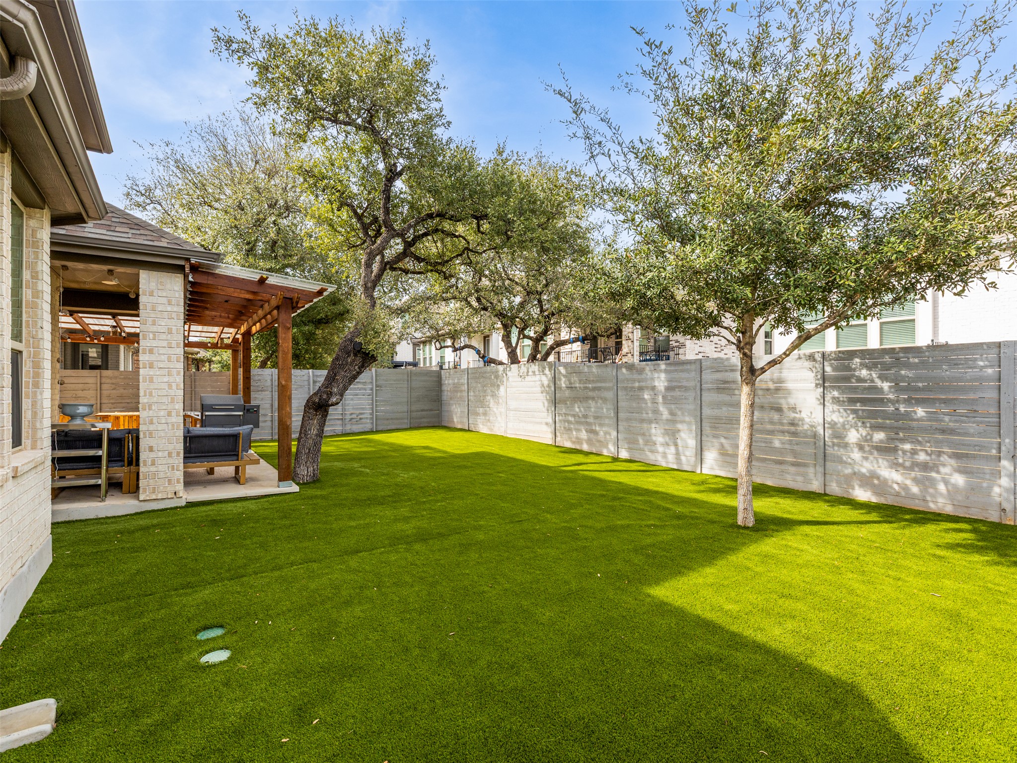 233 Arrowhead Mound Road Georgetown, TX 78628 - Photo 26 of 40 Fenced backyard with a patio