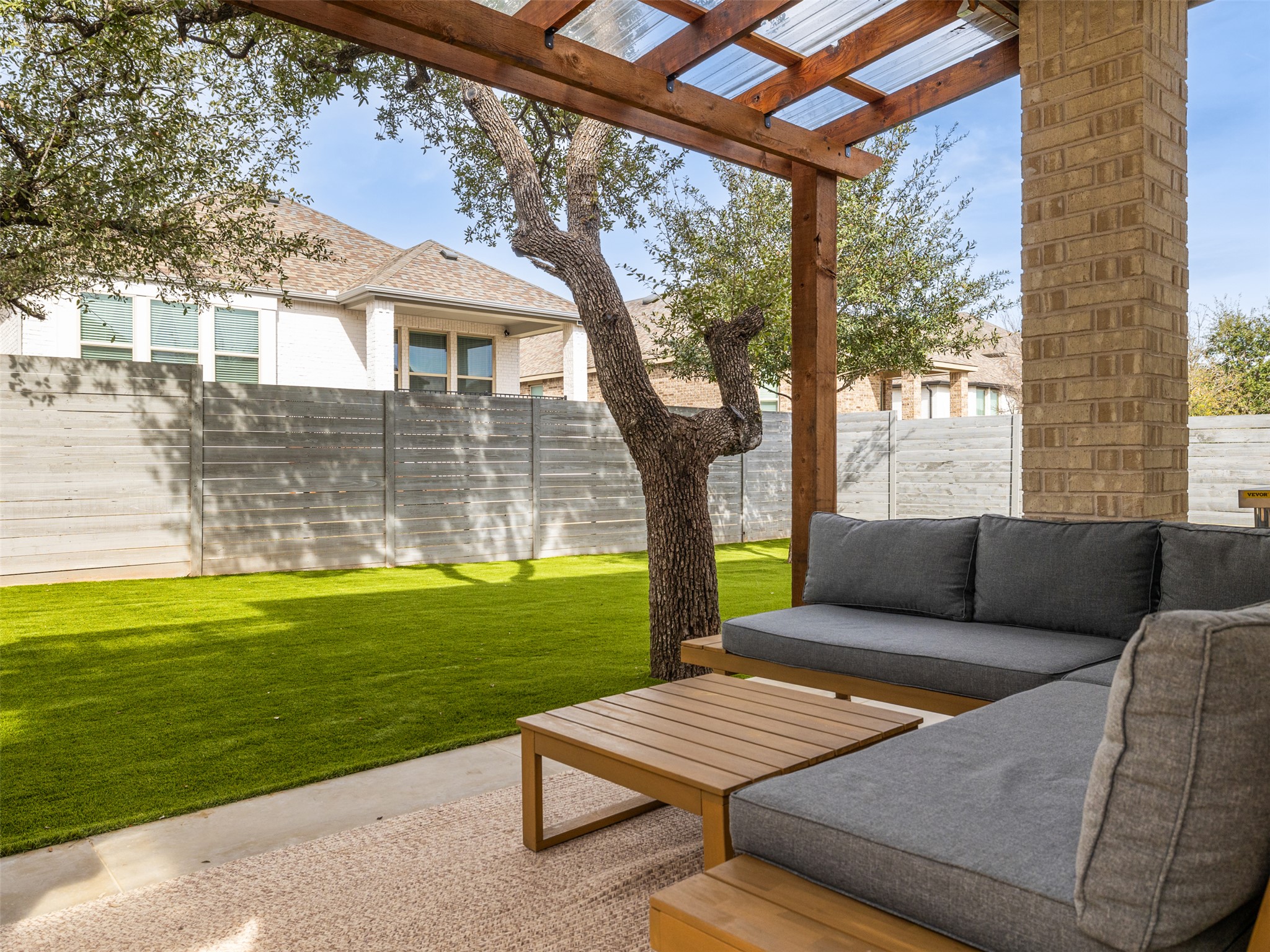 233 Arrowhead Mound Road Georgetown, TX 78628 - Photo 28 of 40 Fenced backyard with outdoor lounge area, a patio, and a pergola