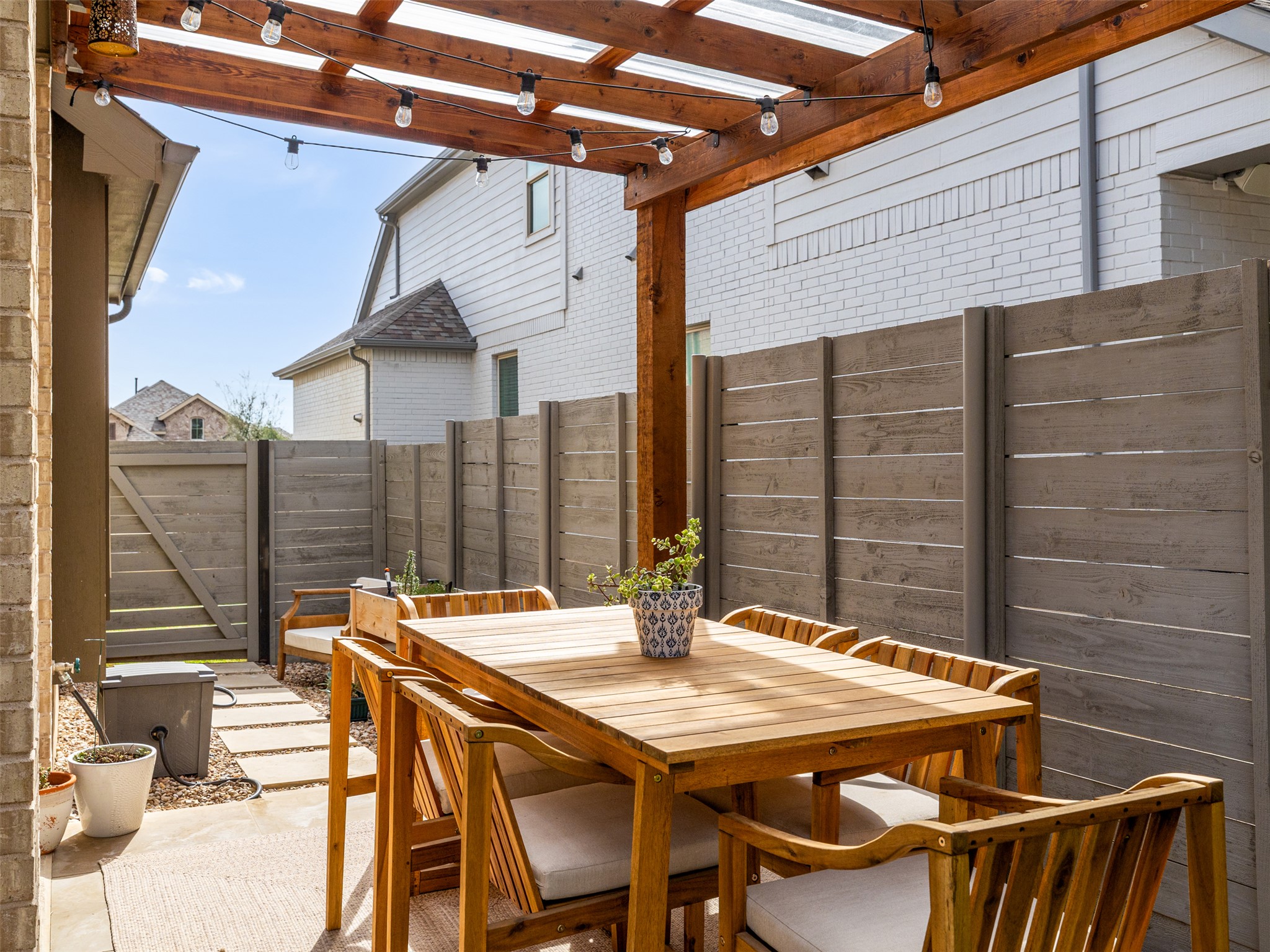 233 Arrowhead Mound Road Georgetown, TX 78628 - Photo 30 of 40 Fenced backyard featuring outdoor dining area, a patio, and a pergola