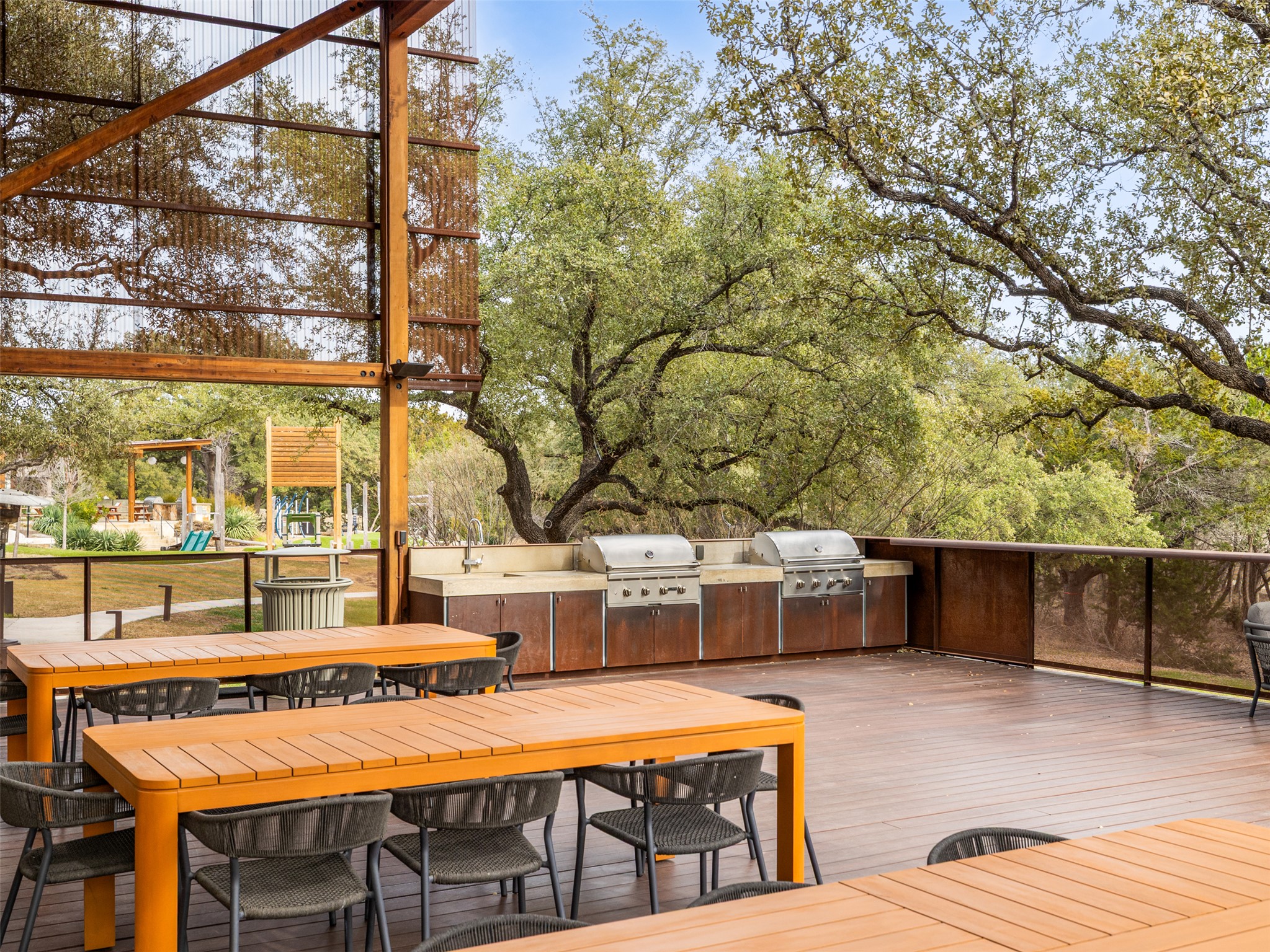 233 Arrowhead Mound Road Georgetown, TX 78628 - Photo 38 of 40 Wooden deck with a playground and an outdoor kitchen / dining area