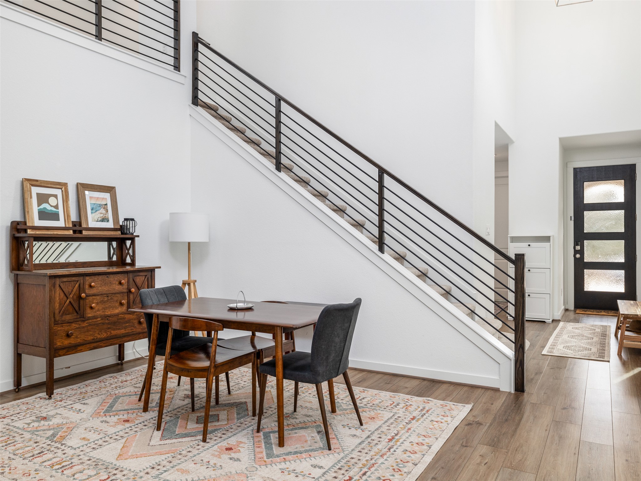 233 Arrowhead Mound Road Georgetown, TX 78628 - Photo 4 of 40 Dining space with light wood finished floors and a high ceiling