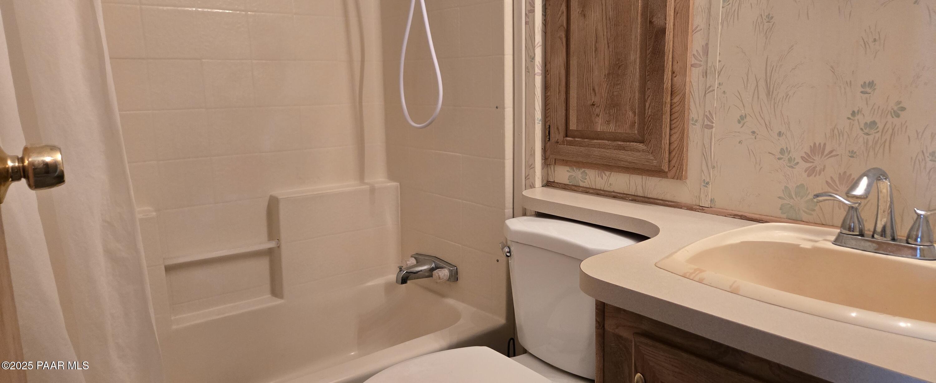 11250 East State Rte 69, Unit 61 Prescott Valley, AZ 86314 - Photo 12 of 41 a bathroom with a sink and toilet