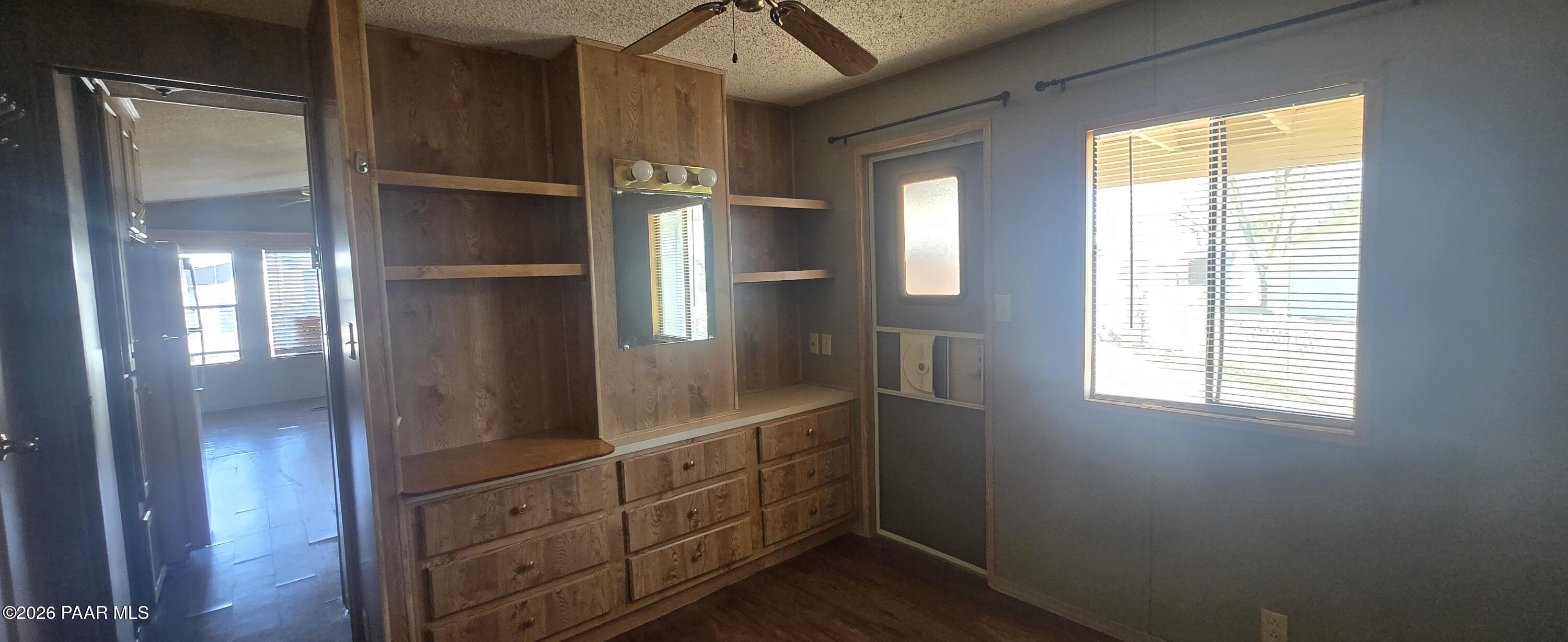 11250 East State Rte 69, Unit 61 Prescott Valley, AZ 86314 - Photo 14 of 41 a kitchen with cabinets and a window