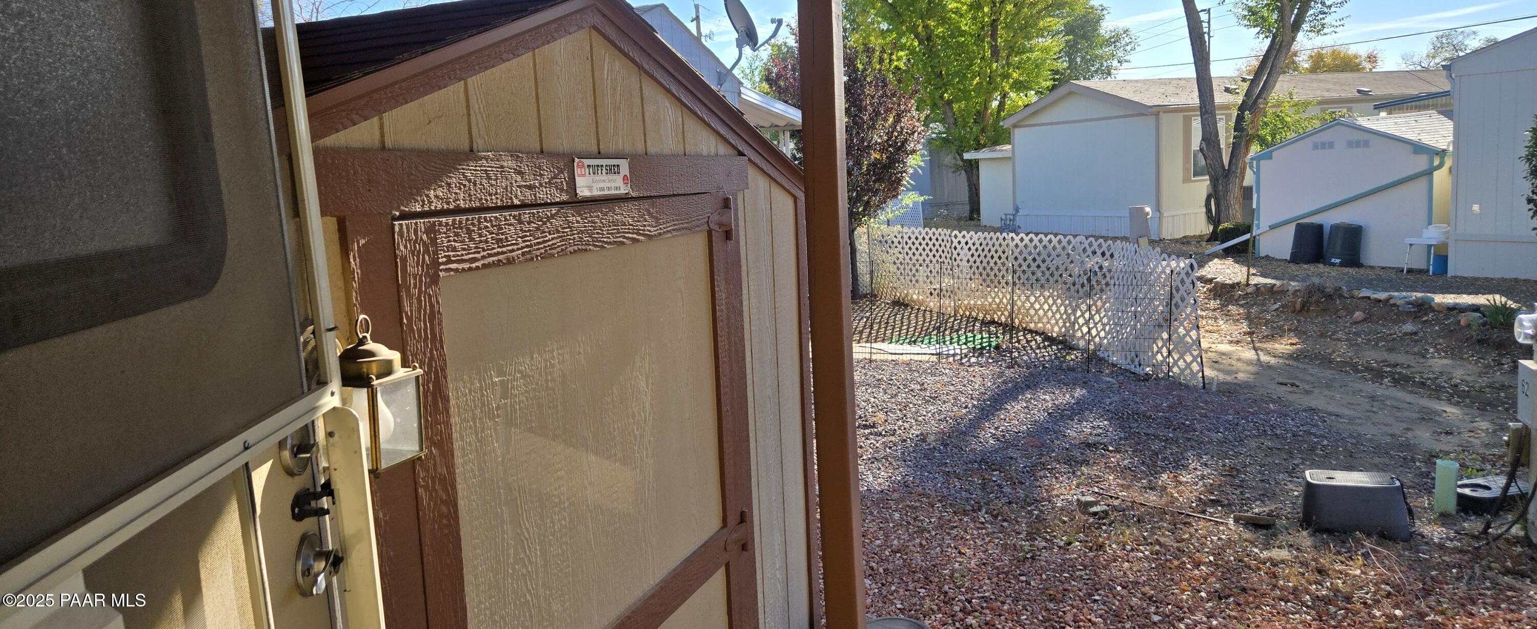 11250 East State Rte 69, Unit 61 Prescott Valley, AZ 86314 - Photo 17 of 41 a front view of a house with a yard