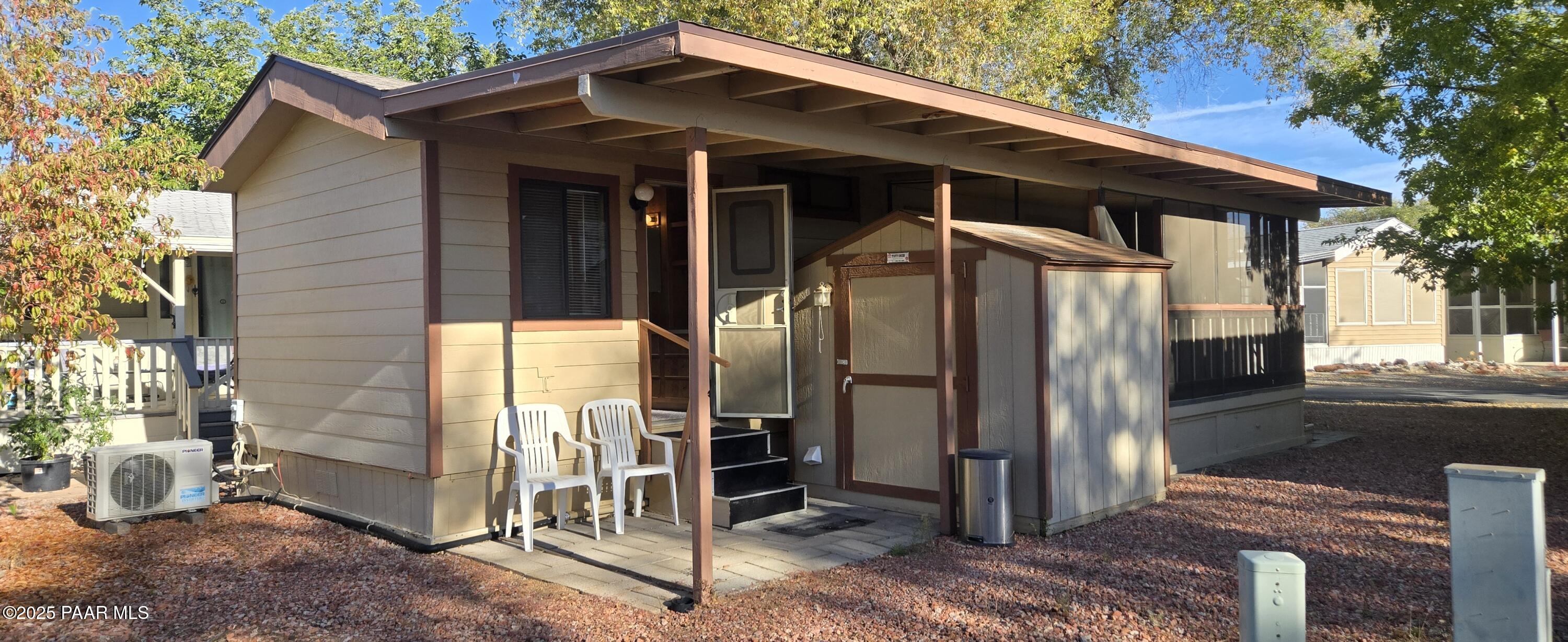 11250 East State Rte 69, Unit 61 Prescott Valley, AZ 86314 - Photo 18 of 41 a front view of a house with a porch