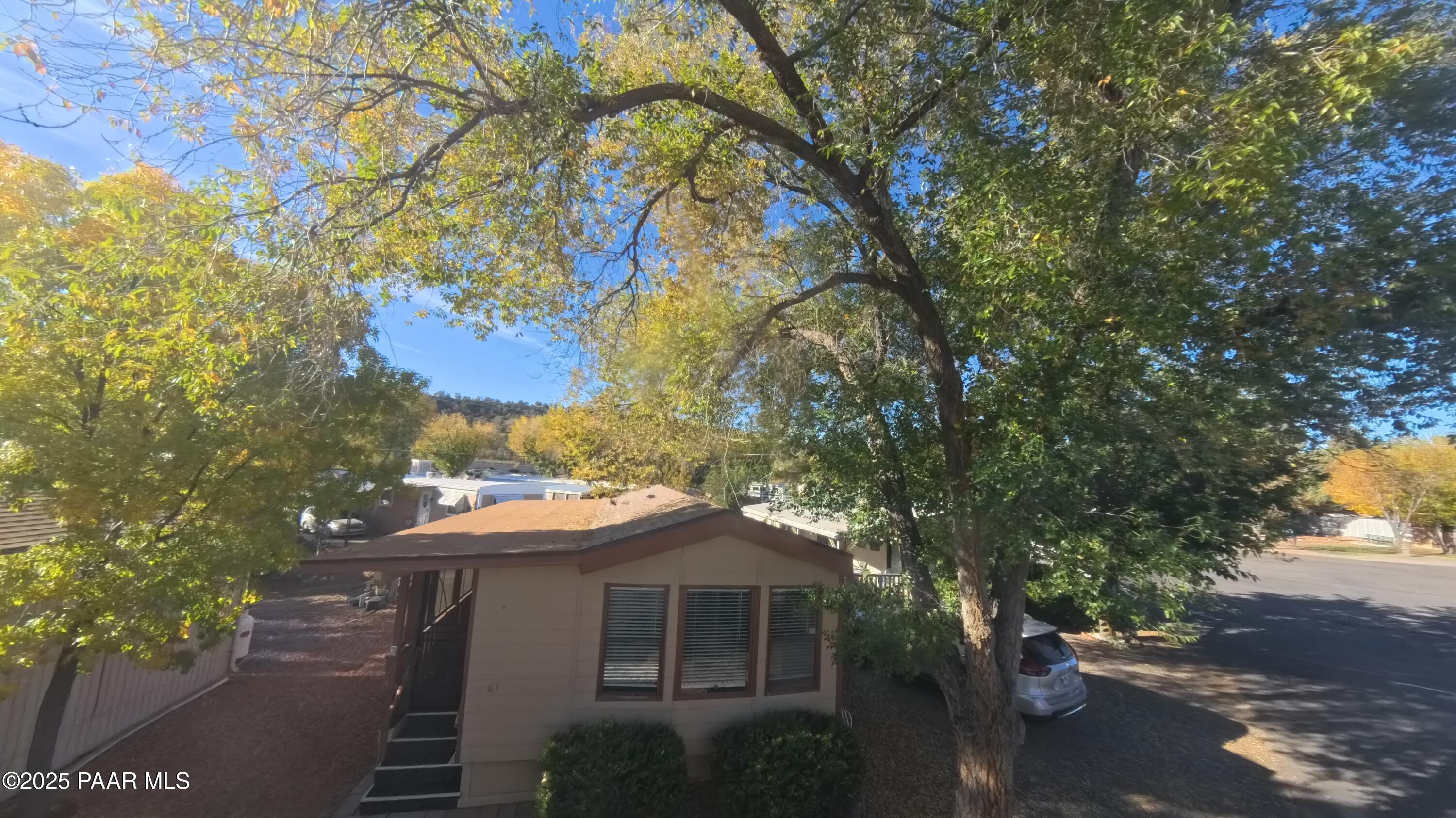 11250 East State Rte 69, Unit 61 Prescott Valley, AZ 86314 - Photo 21 of 41 a view of a house with a tree