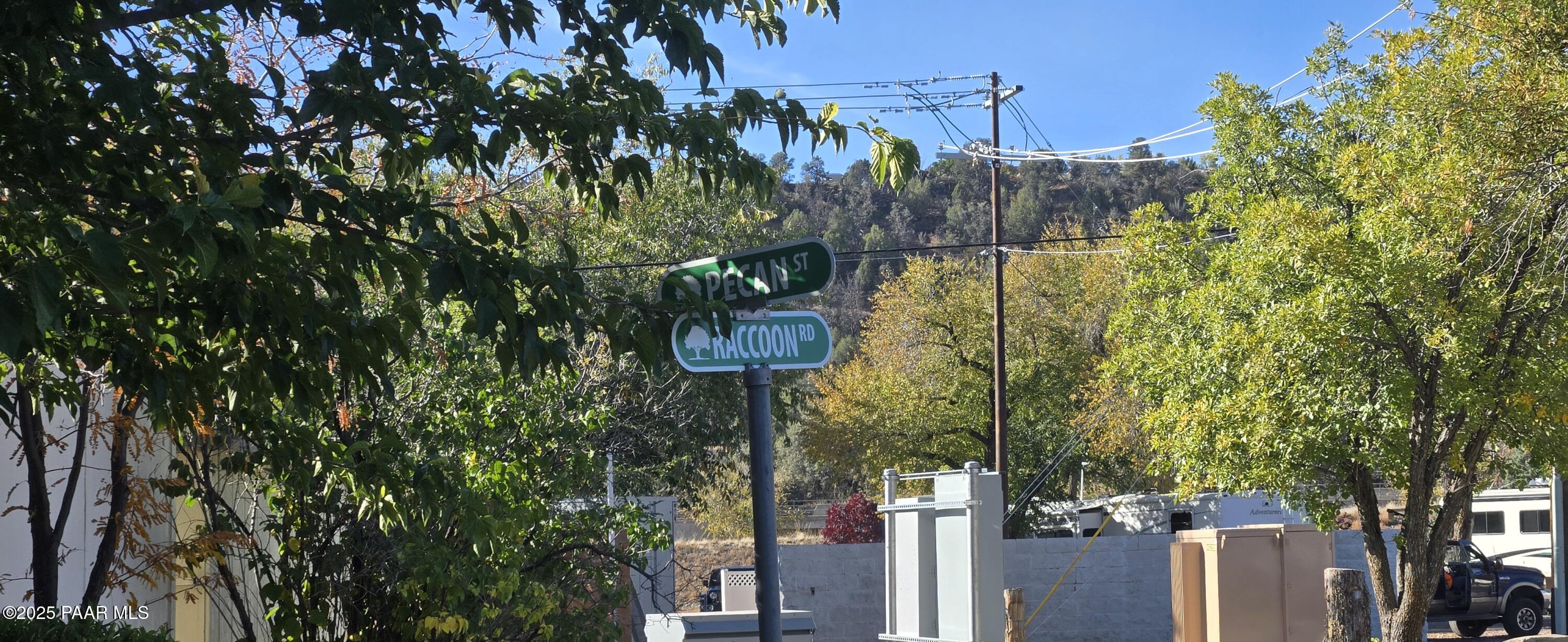11250 East State Rte 69, Unit 61 Prescott Valley, AZ 86314 - Photo 29 of 41 a street sign on a wall next to a road