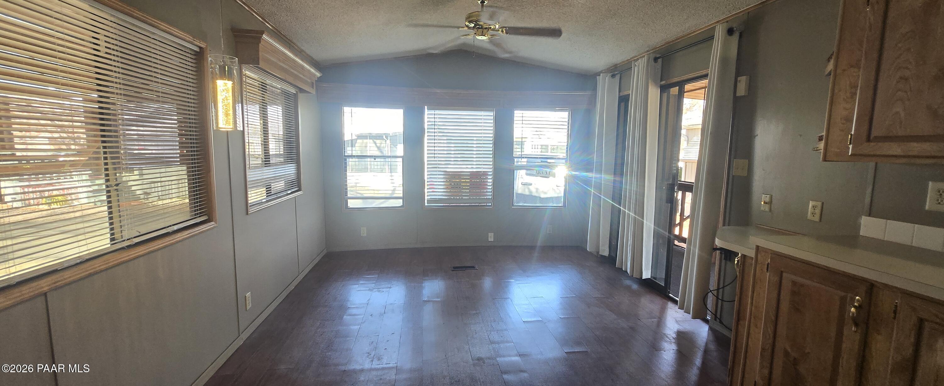 11250 East State Rte 69, Unit 61 Prescott Valley, AZ 86314 - Photo 6 of 41 a view of hallway with windows and wooden floor