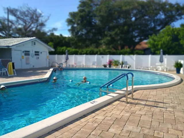 a view of a swimming pool with a patio