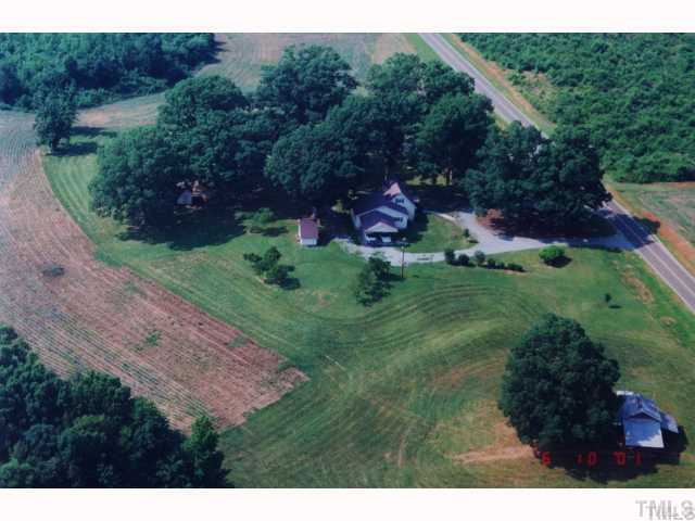 1100 Tatum Road Roxboro, NC 27574 - Photo 1 of 10 a backyard of a house with a yard and outdoor seating