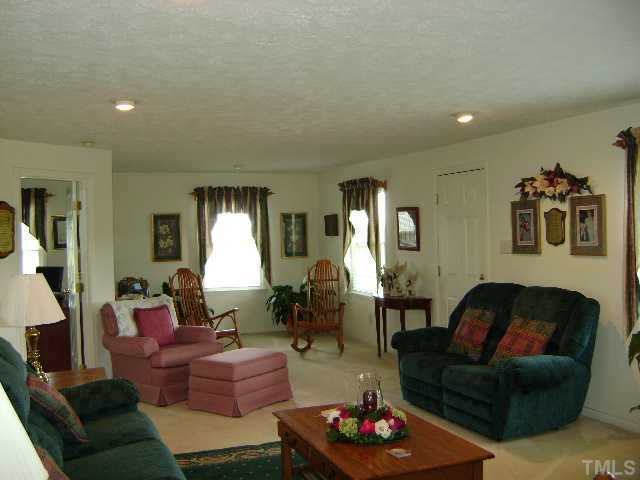 1100 Tatum Road Roxboro, NC 27574 - Photo 3 of 10 a living room with furniture and a large window
