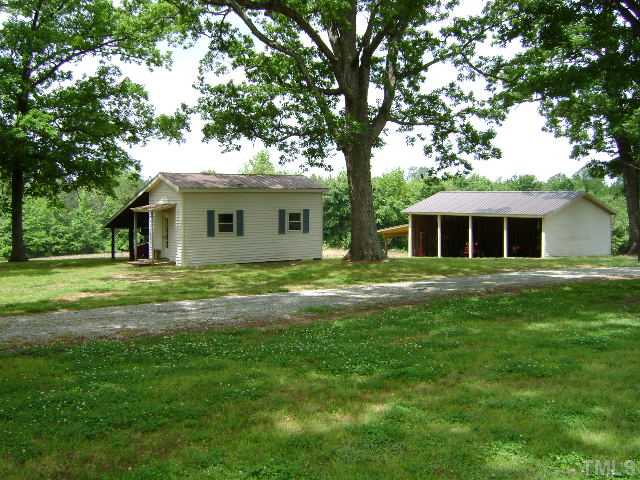 1100 Tatum Road Roxboro, NC 27574 - Photo 7 of 10 a front view of house with yard and green space