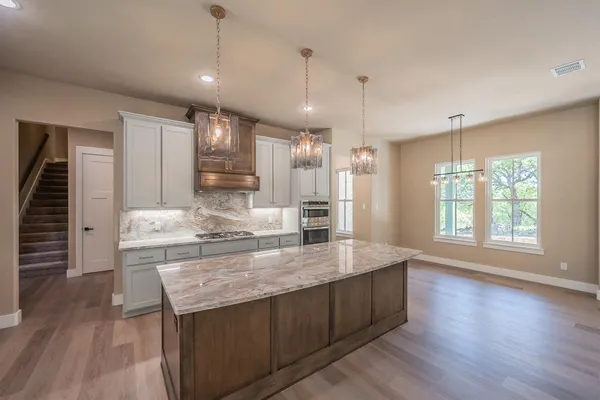 a bathroom with a bathtub and a sink