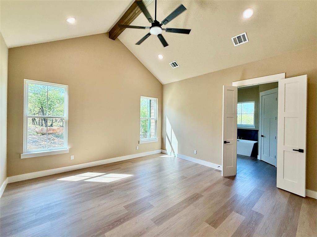114 Ridgeline Drive Chico, TX 76431 - Photo 11 of 23 a view of an empty room with window and wooden floor